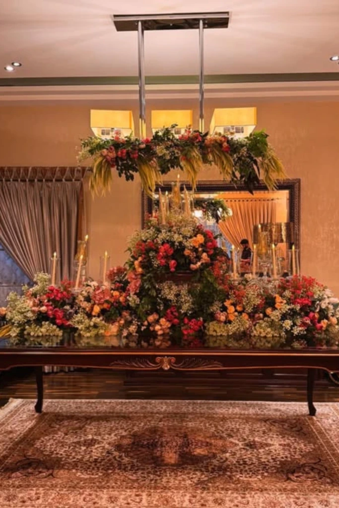 Lush Floral Table Center with Candle Glow