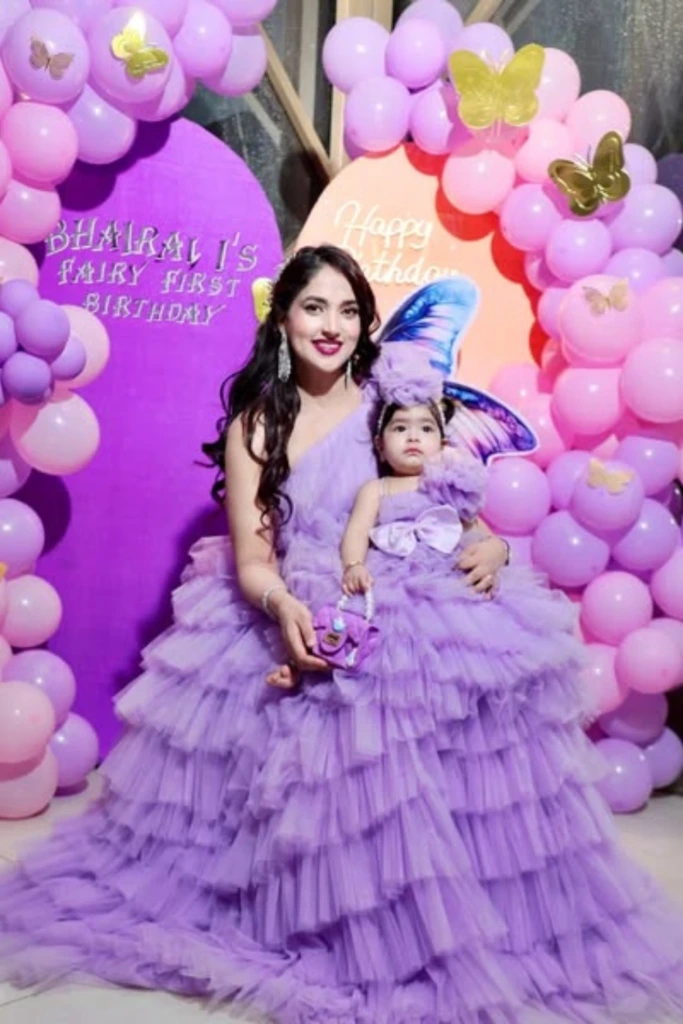 Matching Lavender Outfits with Butterfly Backdrop