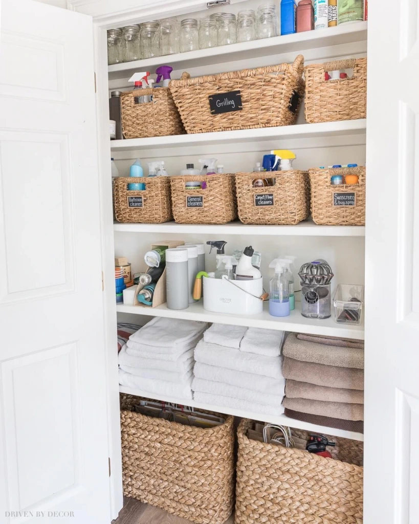 2. Organized Cleaning Closet with Labeled Woven Baskets