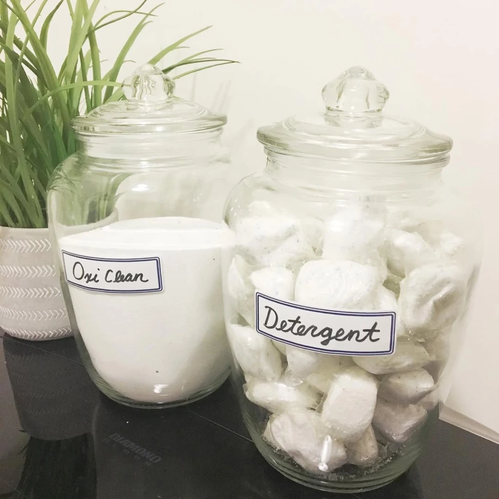 11. Glass Apothecary Jars for Detergent Pods and Powder