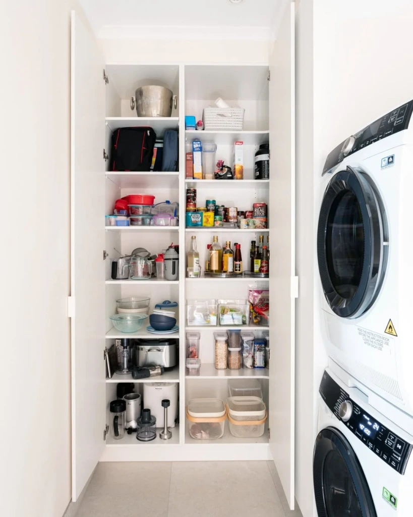 4. Built-In Pantry Beside Stacked Machines