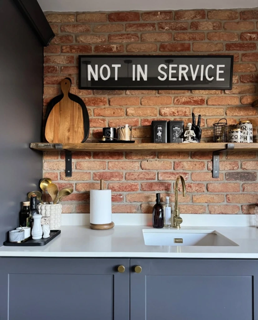3. Industrial Brick Kitchen with Statement Shelf Styling