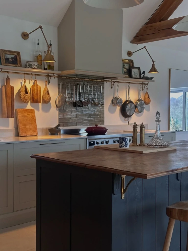 6. Classic Farmhouse Kitchen with Hanging Utensils and Open Shelves