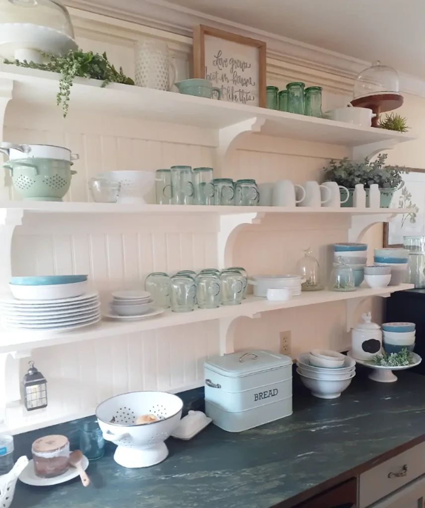 8. Vintage Cottage Shelving with Pastel Glassware