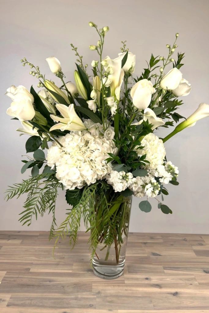 15. Timeless Glass Vase Flower Centerpiece