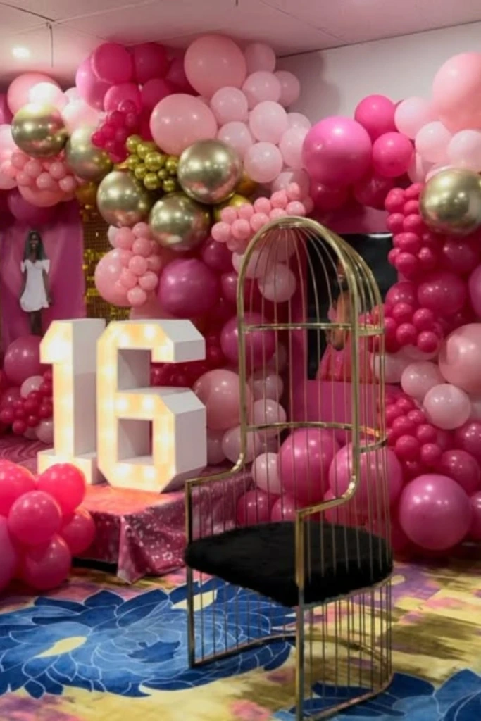Bold Pink Balloon Wall with Throne Chair